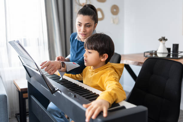 Boy at piano lessons